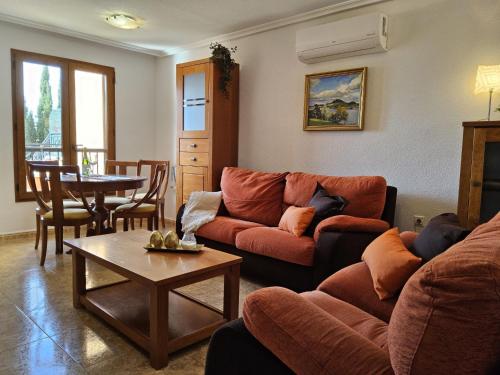 a living room with a couch and a table at Holiday Home Balcon de Finestrat by Interhome in Finestrat