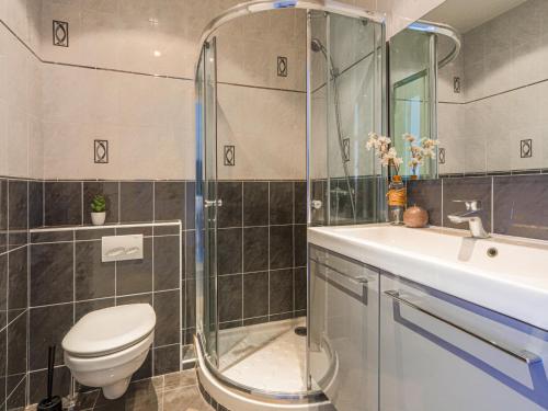a bathroom with a shower and a toilet and a sink at Studio La Joconde by Interhome in Nice