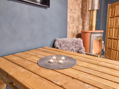 a wooden table with a plate on top of it at Studio Lesní plovárna by Interhome in Mladé Buky