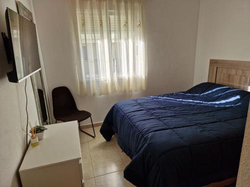 A bed or beds in a room at Relax en la playa