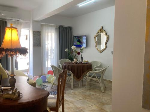 a dining room with a table and chairs at Lucky Suites in Rethymno Town