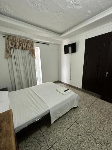 Una cama o camas en una habitación de Apartaestudio Luiggis Cucuta