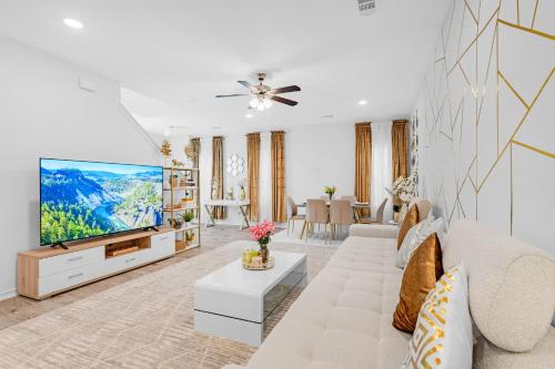 a living room with a couch and a tv at Grand Prairie Gem Near DFW airport AT&T Stadium in Grand Prairie