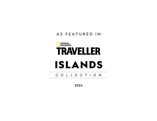 een poster voor een reisbureau met de woorden Traveller Islands collectie bij Lighthouse Hotel and Spa, Little Corn island, Nicaragua in Little Corn Island