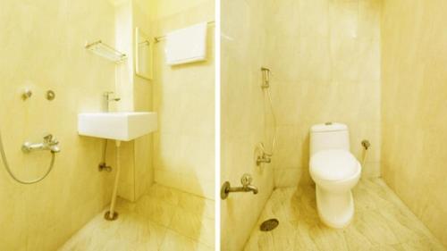 a bathroom with a toilet and a sink at Vaishnavi Residency, Srikalahasti in Srikalahasti