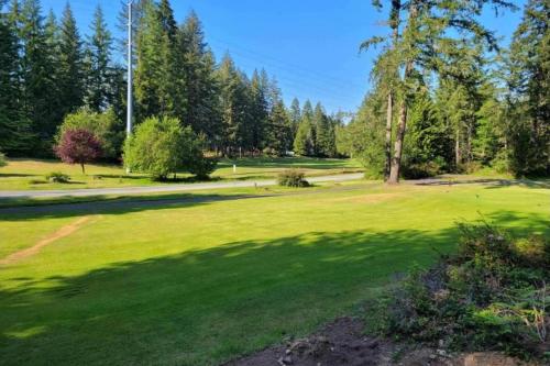 a large green field with trees in the background at Un-Fore-gettable in Union