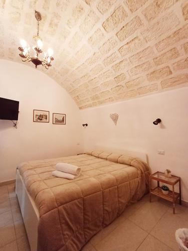 a bedroom with a bed with a wooden ceiling at SAN MARCO in Bari