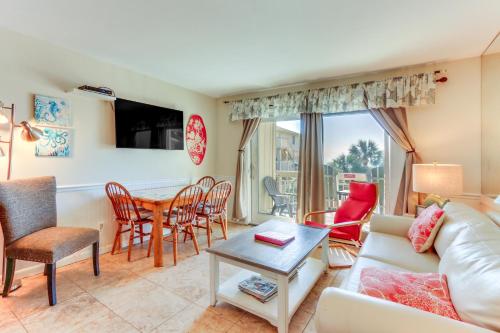 a living room with a couch and a table at Ocean-View Balcony Beachfront Hilton Head Condo in Hilton Head Island