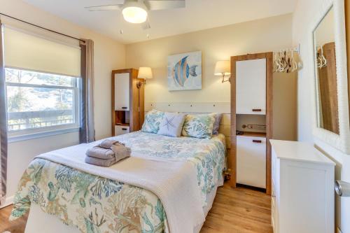 a bedroom with a bed and a window at Ocean-View Balcony Beachfront Hilton Head Condo in Hilton Head Island