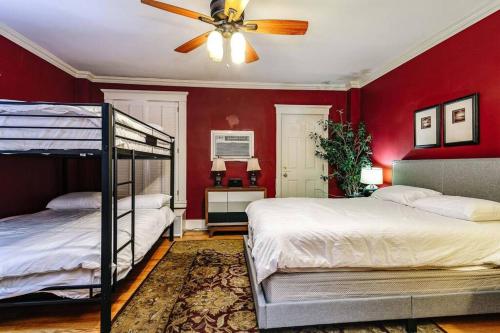 a bedroom with two beds and a ceiling fan at Brownstone in Gold Coast - Downtown in Chicago