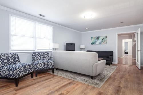 a living room with a couch and two chairs at Beautiful Remodeled Penthouse Unit in Old Town in Chicago