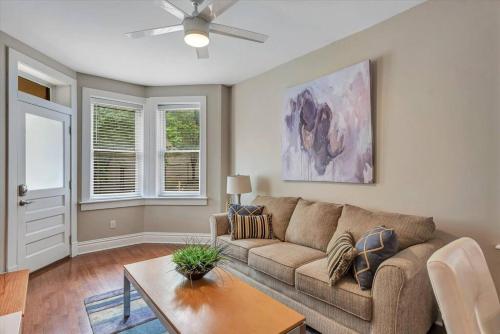 a living room with a couch and a table at Stunning Townhome 920 in The Grove in Tower Grove