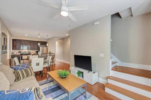 a living room with a couch and a table at Stunning Townhome 920 in The Grove in Tower Grove