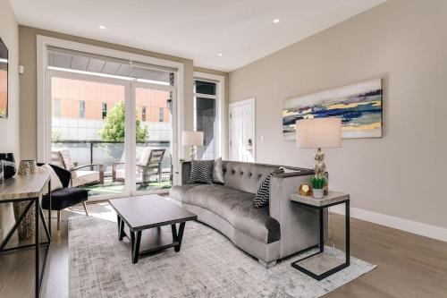 a living room with a couch and a table at Stunning Duplex Condo #1 - Downtown River North in Chicago