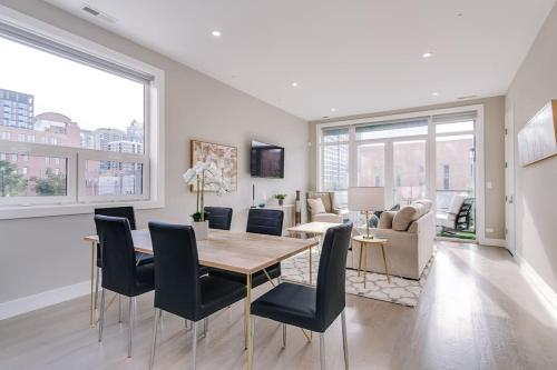 a dining room and living room with a table and chairs at Stunning Condo #2 - Downtown River North in Chicago