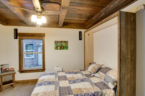 a bedroom with a bed with a wooden ceiling at Shared Game Room Dazzling Cle Elum Home in Ronald
