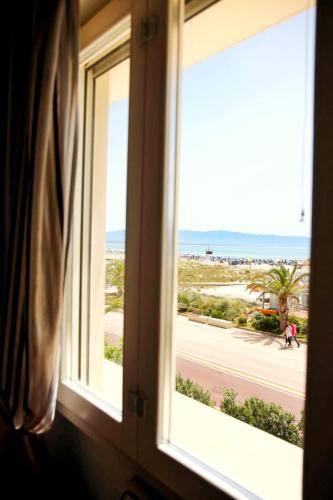 a window with a view of a beach at Villa Maria Luisa in Cagliari