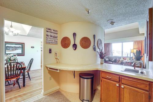 a kitchen with a counter with utensils on the wall at Pool & Hot Tub: Mtn-View Condo in Sugartop Resort! in Sugar Mountain