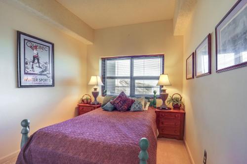 a bedroom with a bed with purple sheets and a window at Pool & Hot Tub: Mtn-View Condo in Sugartop Resort! in Sugar Mountain