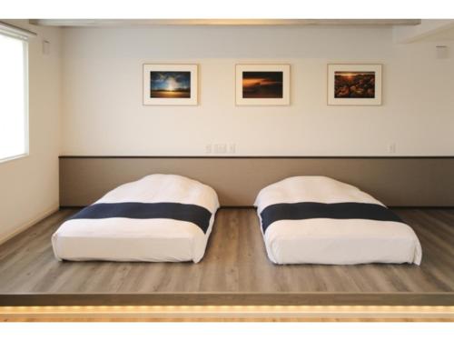 two beds sitting on the floor in a room at Phottage inn Biei - Vacation STAY 20948v in Biei
