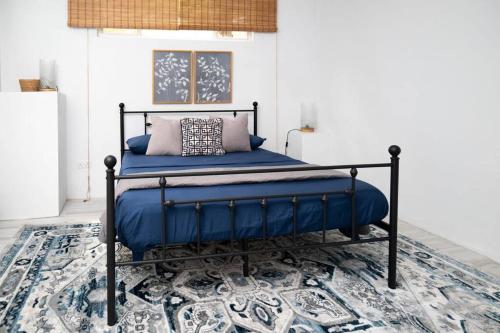 מיטה או מיטות בחדר ב-Azure Belle Caye
