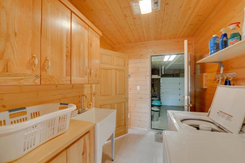 a bathroom with a sink and a washing machine at Cozy Henrys Lake Escape - 20 Miles to Yellowstone! in Island Park