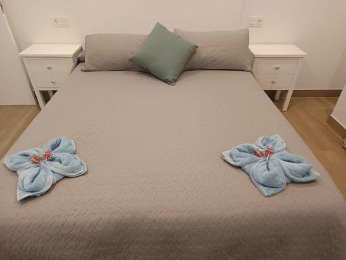 a bed with two towels on top of it at Mojacar Luxury in Mojácar