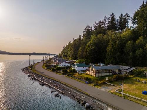 an aerial view of a town next to a body of water at Alert Bay Lodge in Alert Bay