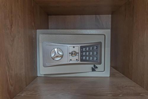 a microwave oven with its door open in a cabinet at Royal Living Poblado in Medellín