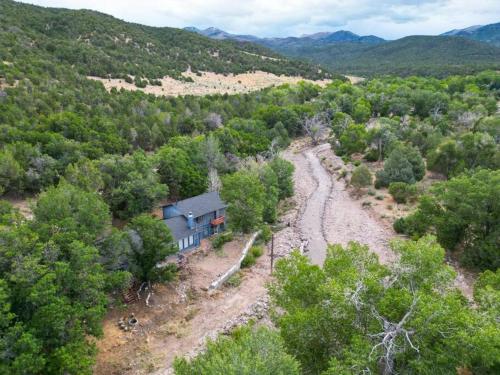 an aerial view of a house in a forest at Mountain Home w/ a River in Back - Close to Skiing in Beaver
