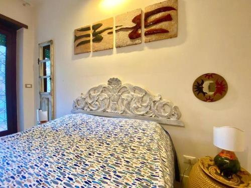 a bedroom with a blue and white bed in it at Fine and large flat with terrace, near the centre and stadium in Rome