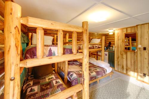 a bedroom with two bunk beds in a log cabin at Studio Cabin on Black Diamond Ranch Hike and Fish 
