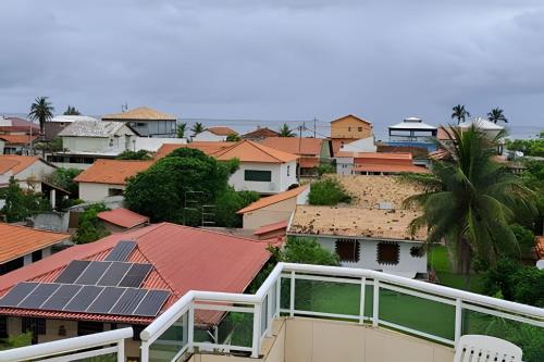 a view of a city with houses with solar panels at Cobertura Pôr do Sol Saquarema in Saquarema
