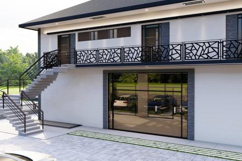 Casa con puertas de cristal y balcón en Kuşadası Kuştur Plajı 1+1, en Kusadasi