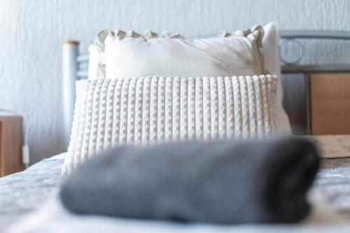 a close up of a pillow on a bed at Pension More in Šibenik