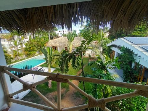 a view from the balcony of a resort with a swimming pool at Casa Shambala B&B in Las Terrenas