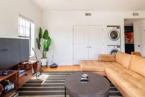 a living room with a couch and a table at 1BR/1Bath Downtown - Newly Renovated Premier Apt. in Gainesville