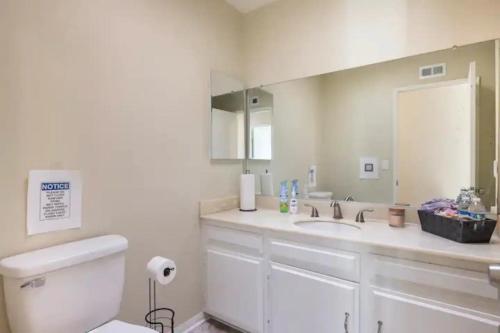 a bathroom with a sink and a toilet and a mirror at Santa Clarita Mountain Top in Santa Clarita