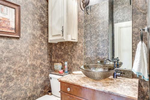 a bathroom with a bowl sink on a counter at Spacious Edmond Vacation Rental with Shared Pool! in Edmond