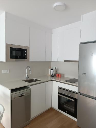 Η κουζίνα ή μικρή κουζίνα στο Apartamento Andmar Beach
