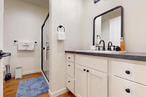 a bathroom with a sink and a mirror at Fountain District Bungalow in Bellingham