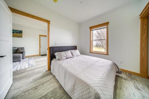 a bedroom with a bed and a window at Welcoming Erie Condo with Golf and Lake Views! in Erie
