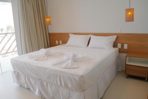 Uma cama ou camas num quarto em Oiti Beach Resort Tutoia