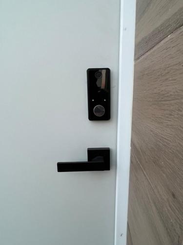 a door with a black door knocker on it at Casa V25 in Querétaro