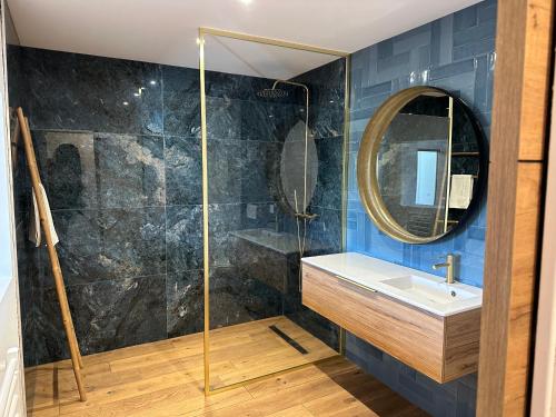 a bathroom with a sink and a mirror at La poudrière in Figari