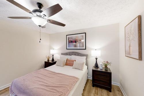 a bedroom with a bed with a ceiling fan at A Peaceful Place in Kennesaw