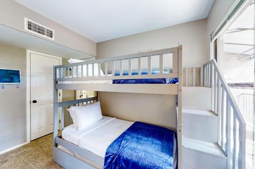 a bunk room with two bunk beds and a staircase at The Greens at Ventana Canyon #1205 in Tucson