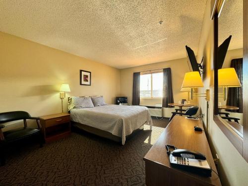 Postel nebo postele na pokoji v ubytování Quilt Inn