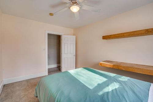 a bedroom with a bed and a ceiling fan at Altmar Home with Fire Pit Less Than 1 Mi to Salmon River! in Pulaski