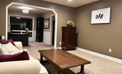 a living room with a couch and a coffee table at Sopra Bella- 4 bedroom home in Corvallis